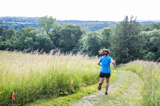 2017 50K Winner Jayna Tomalty Running Campground - Photo Credit Fresh Tracks Media