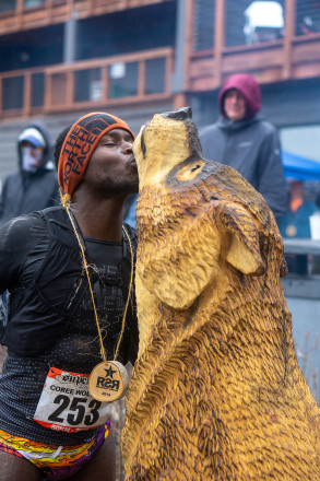 Coree Woltering Kisses the Wolf After His 2019 50K Win - Photo Credit Jamison Swift