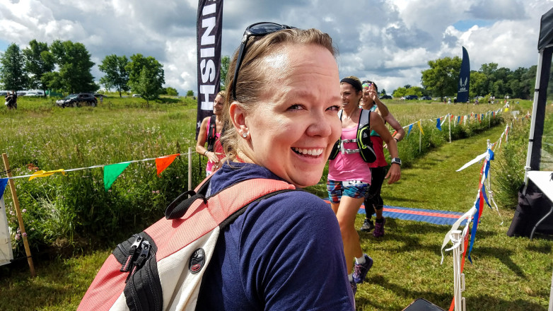 Natalie Working the Finish Line and Having Some Fun - Photo Credit John Storkamp