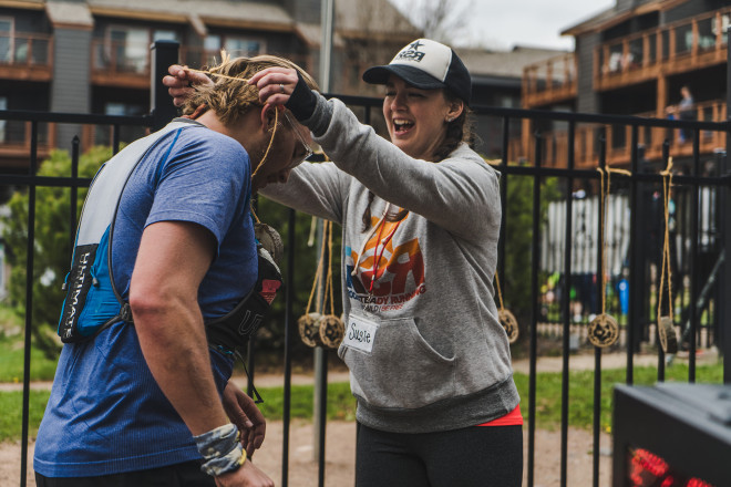 Susie H Greeting Runners with a Smile - Photo Credit Fresh Tracks Media