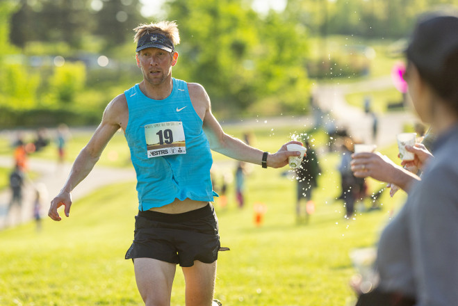 Handoff at the 2024 Lebanon 10K - Photo Credit Scott Rokis