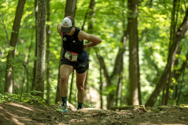 Hands on Hips Climbing Meatgrinder Hill - Photo Credit Cary Johnson