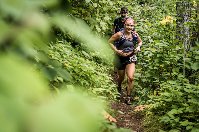 Kelly Teeselink Running Happy Enroute to Her 2019 Superior 100 Win - Photo Credit Ian Corless