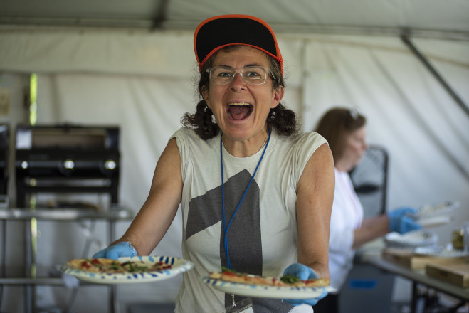 Maria Serving Pizza - Photo Credit Bill Kelley
