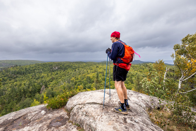 Pat Susnik Taking in the Views from Mt Trudee SFTR 2025 - Photo Credit Scott Rokis