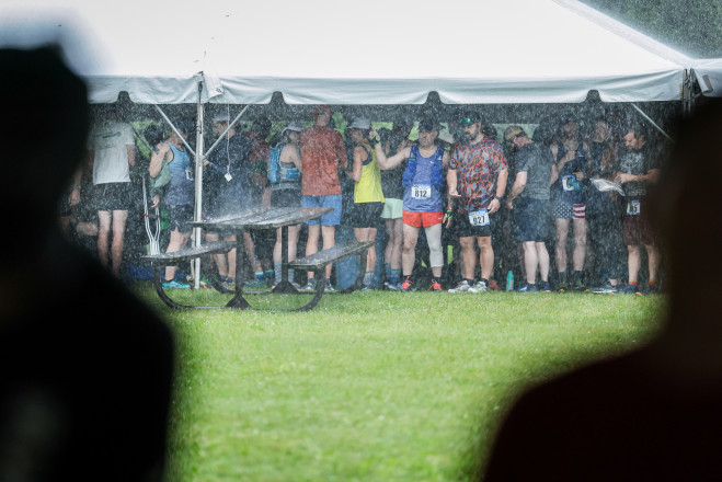 Staying as Dry as Possible Before the 25KM Start in 2025 - Photo Credit Scott Rokis